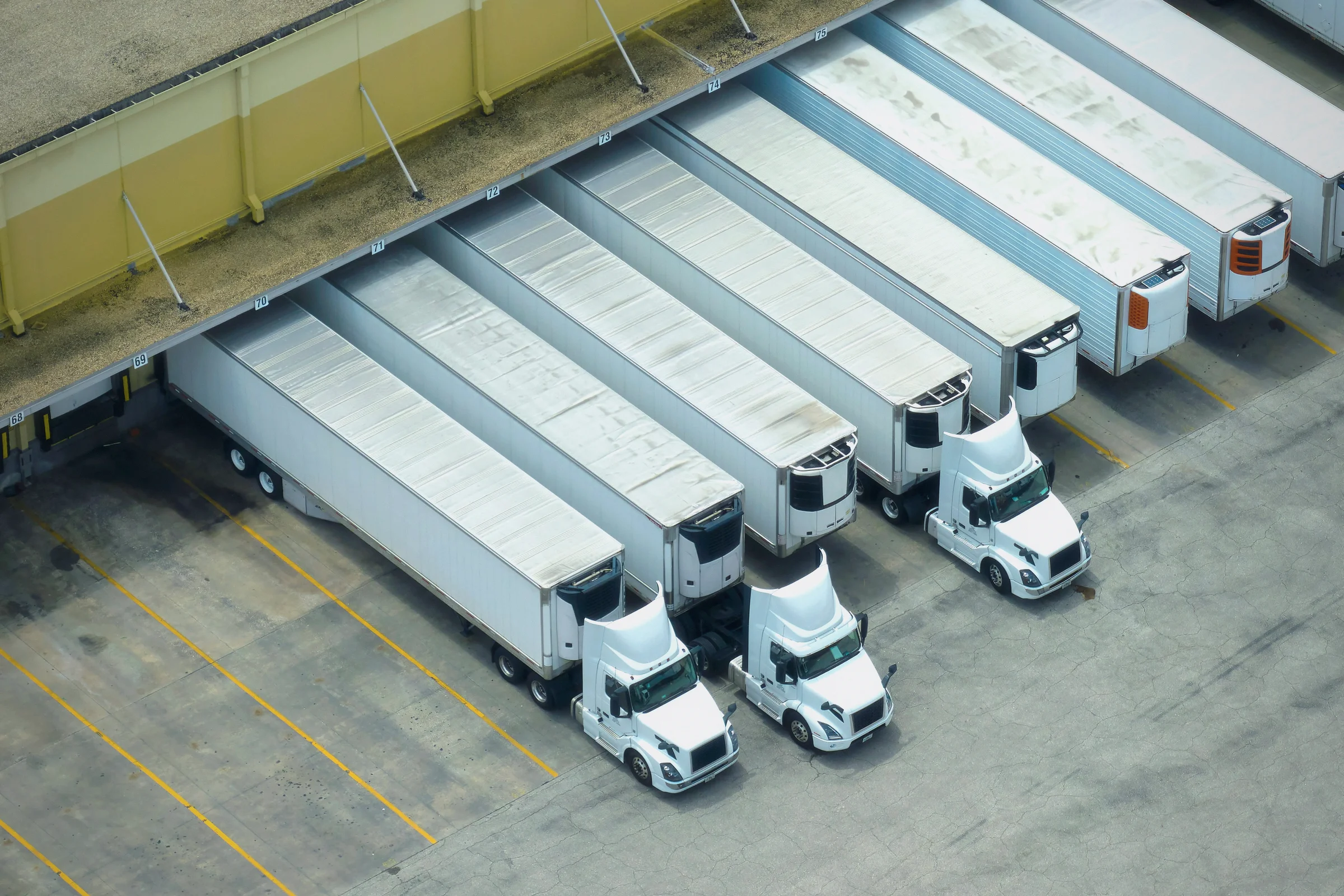 Trucks at warehouse loading dock bays